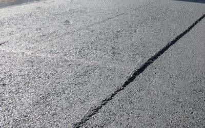 How an Asphalt Paver Works (And Why It Matters for a Smooth Parking Lot or Road)